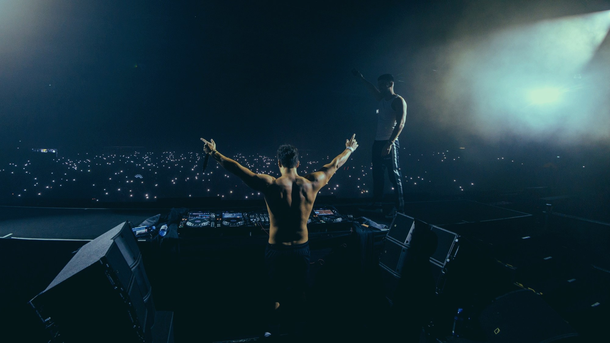 VINAI performing in a blue-lit arena